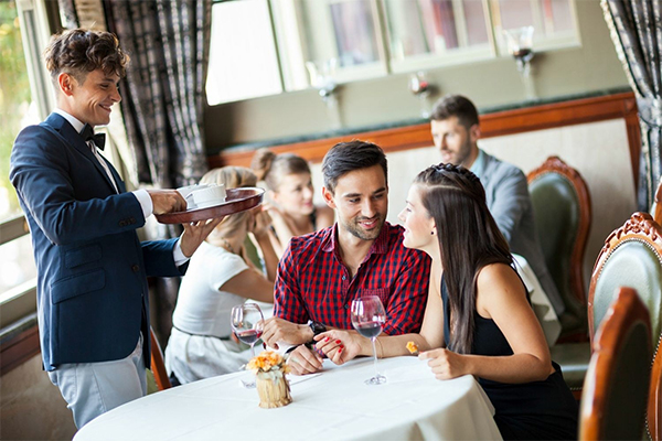 Group of diners with a server.